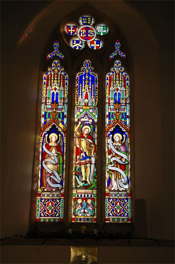 Stained glass window showing St michael (centre panel)