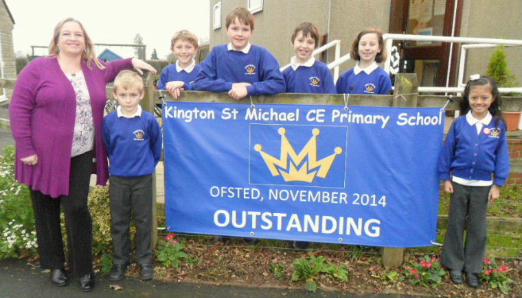 OFSTED result photo - Headteacher Tracy Cornelius and pupils